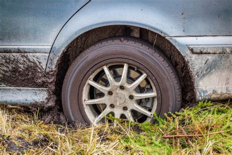 mud cleaner for car|car stuck in wet mud.